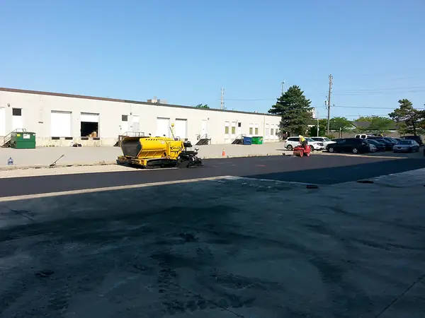 Freshly paved lot outside an industrial unit